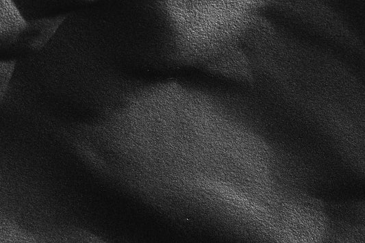 a close up view of a black fabric