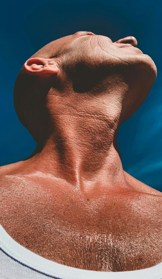 a man's head with a blue background