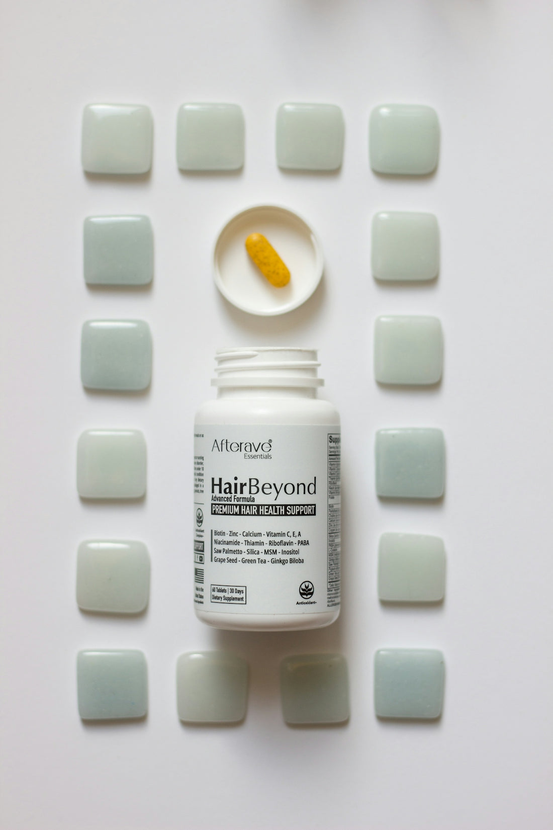 A bottle of hair - beard sitting on top of a table